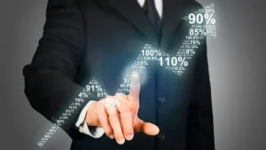 Business professional in dark suit touching glowing virtual graph with percentage statistics, demonstrating digital data visualization